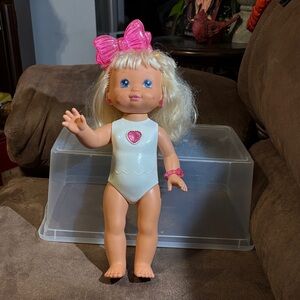 PJ Sparkles: A Charming Blonde Doll with Pink Accessories